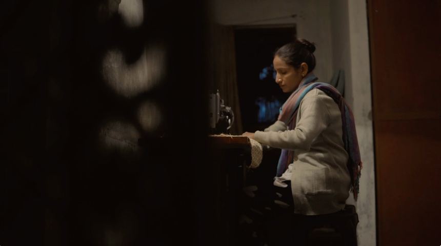 Woman at her sewing machine